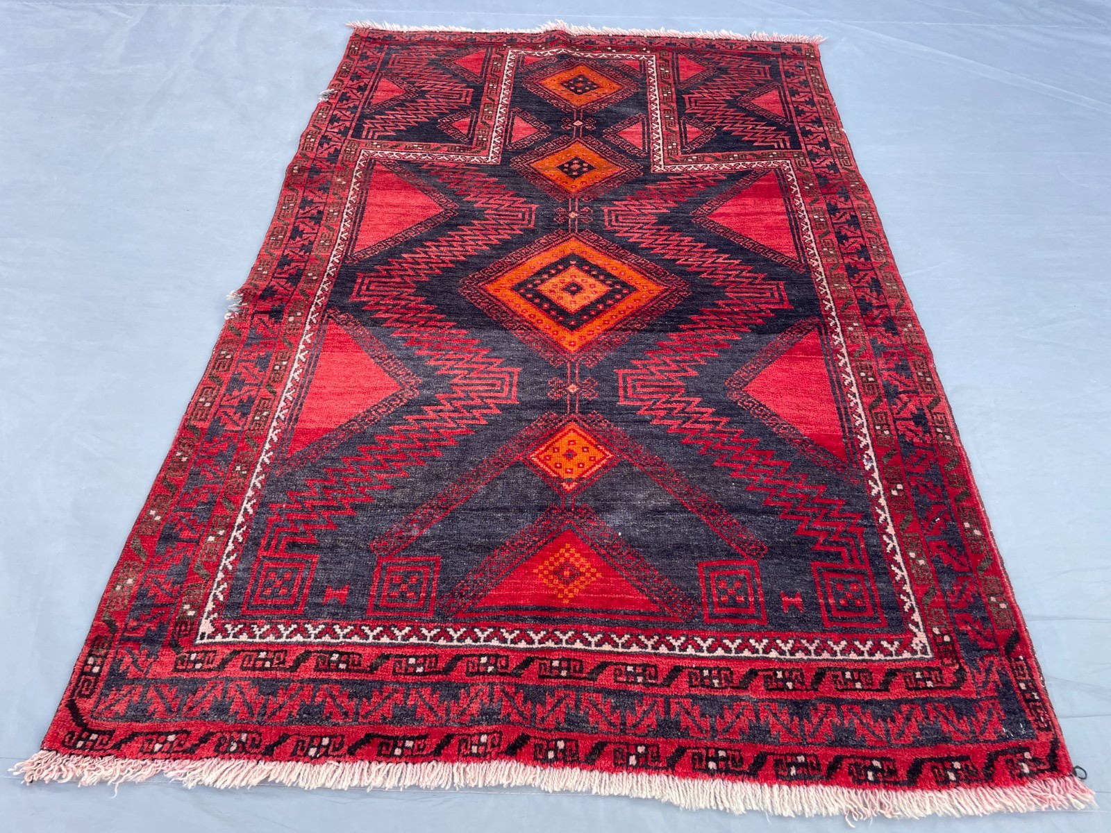 2×4 Bold Baluchi Wool Rug with Angular Medallions and Striking Geometric Borders