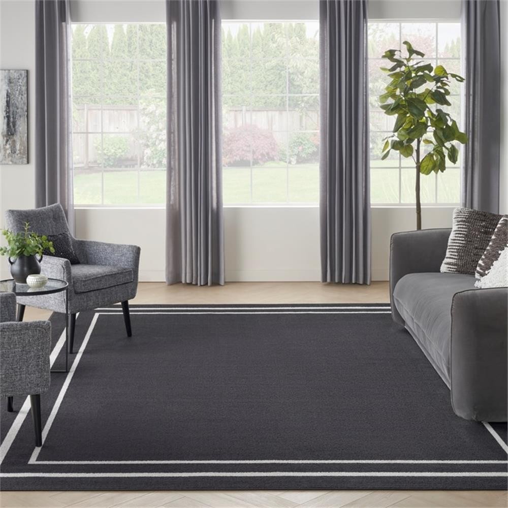 Pemberly Row 108×144″ Fabric Indoor/Outdoor Rug in Black Ivory