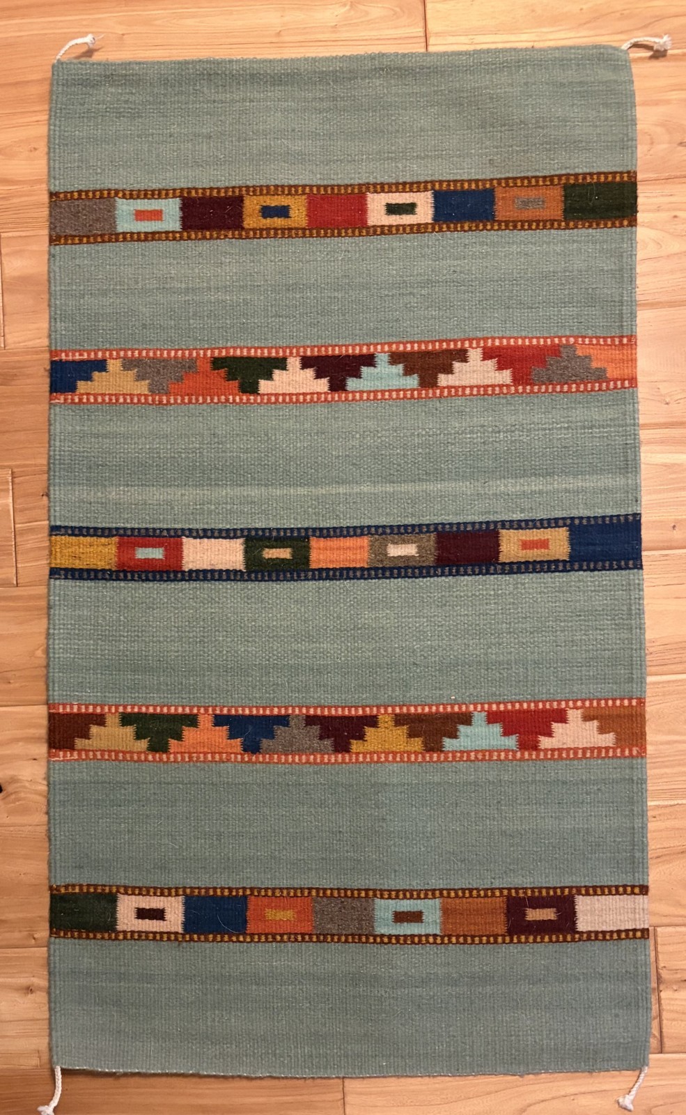 Handmade, 100% wool Aztec wall rug with little use. Roughly 2×3.5 feet.