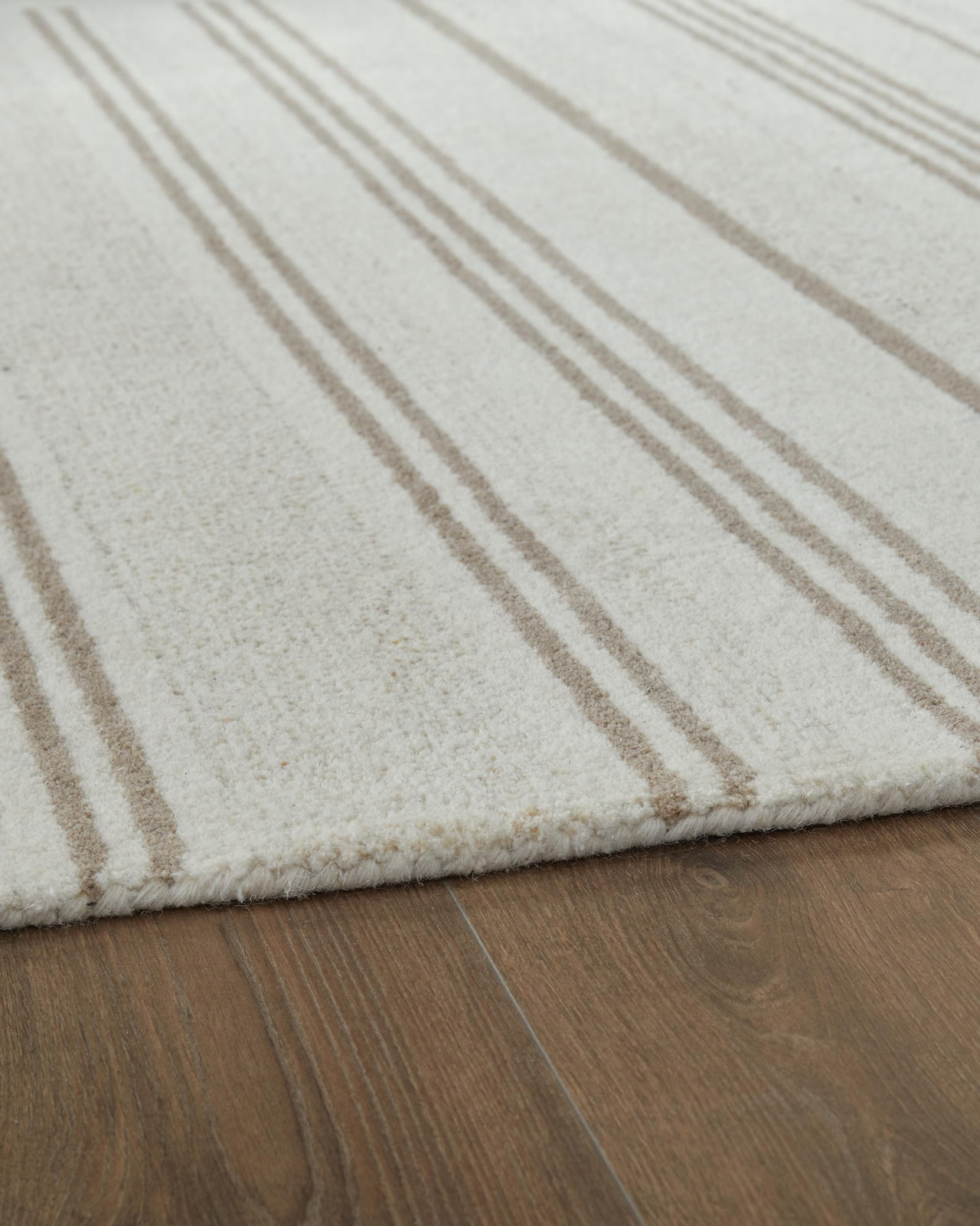 Signature Design by Ashley Gadence 5′ x 7′ Area Rug, Ivory Tan Stripe