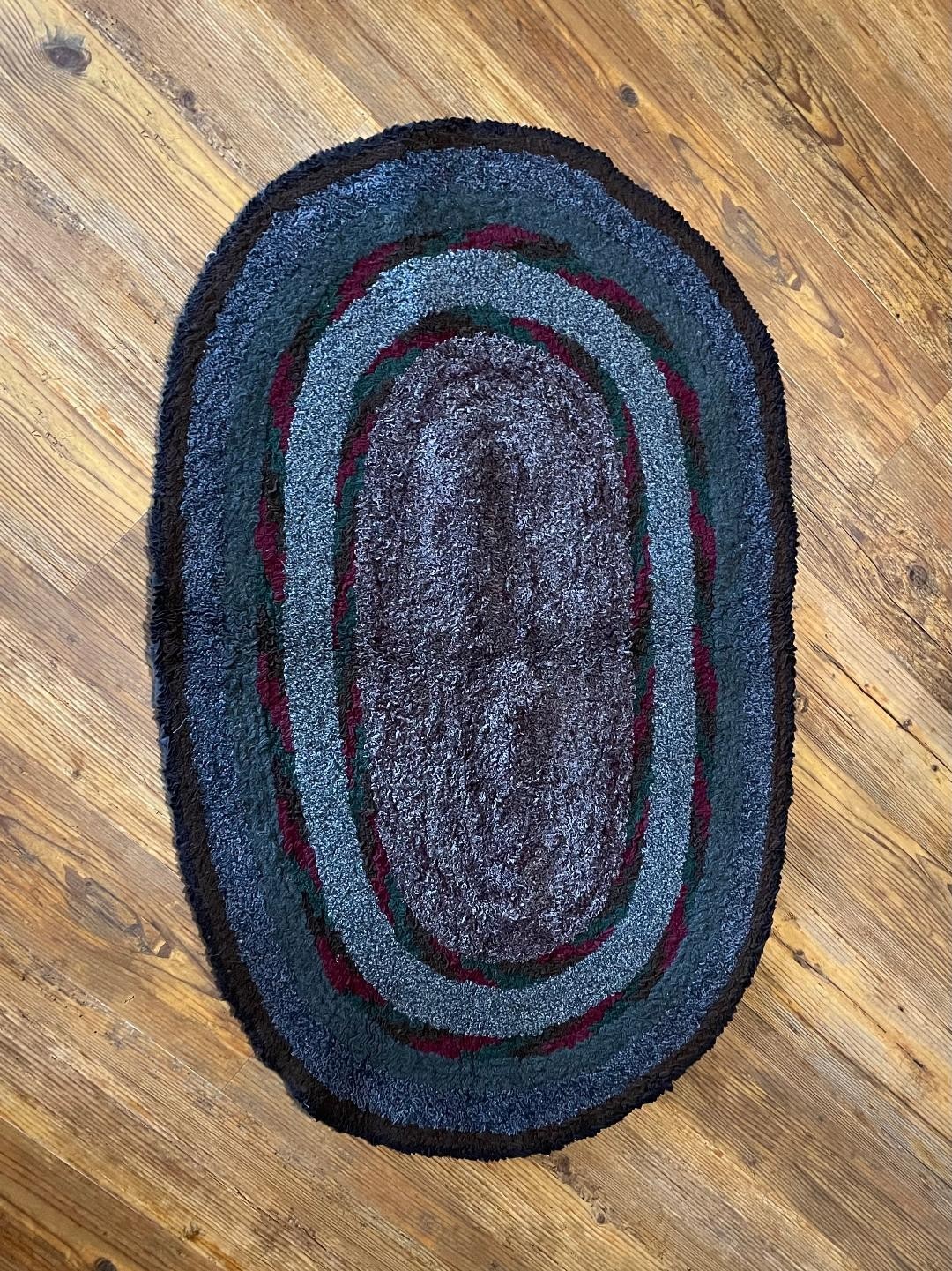 HANDMADE MULTI COLORED OVAL RUG-POSSIBLY WOOL OR COTTON OR BOTH