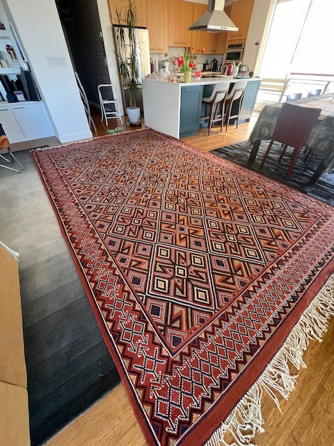 50 years old Algerian wool hand made multi color rug in excellent shape .