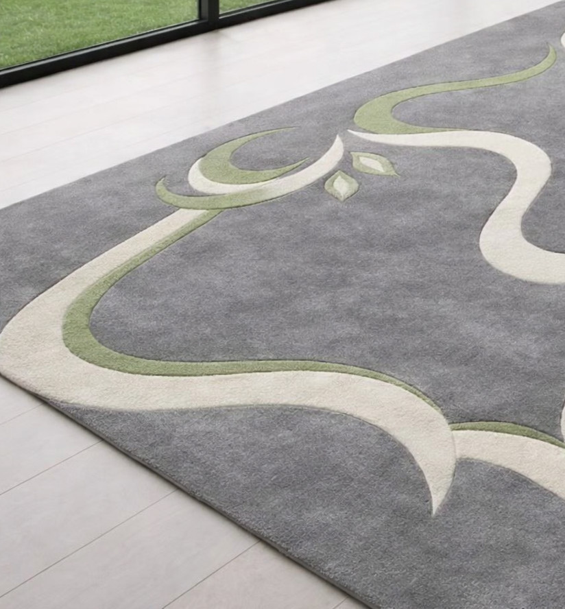 High quality grey carpet with cream & olive green flowing design.