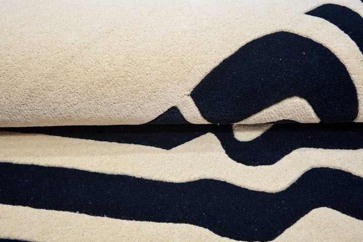 Hand-Tufted Rug, a striking addition to modern interiors. With its dynamic black