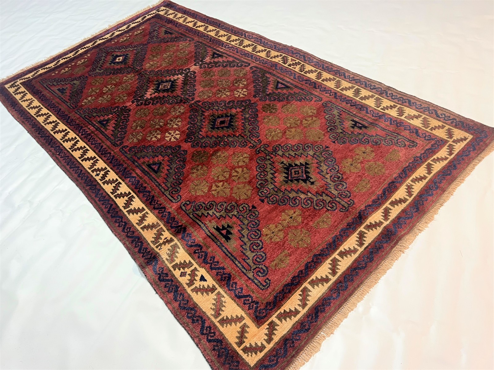 4×6 Vintage Baluchi Wool Rug with Triple Geometric Medallions and Tribal Border