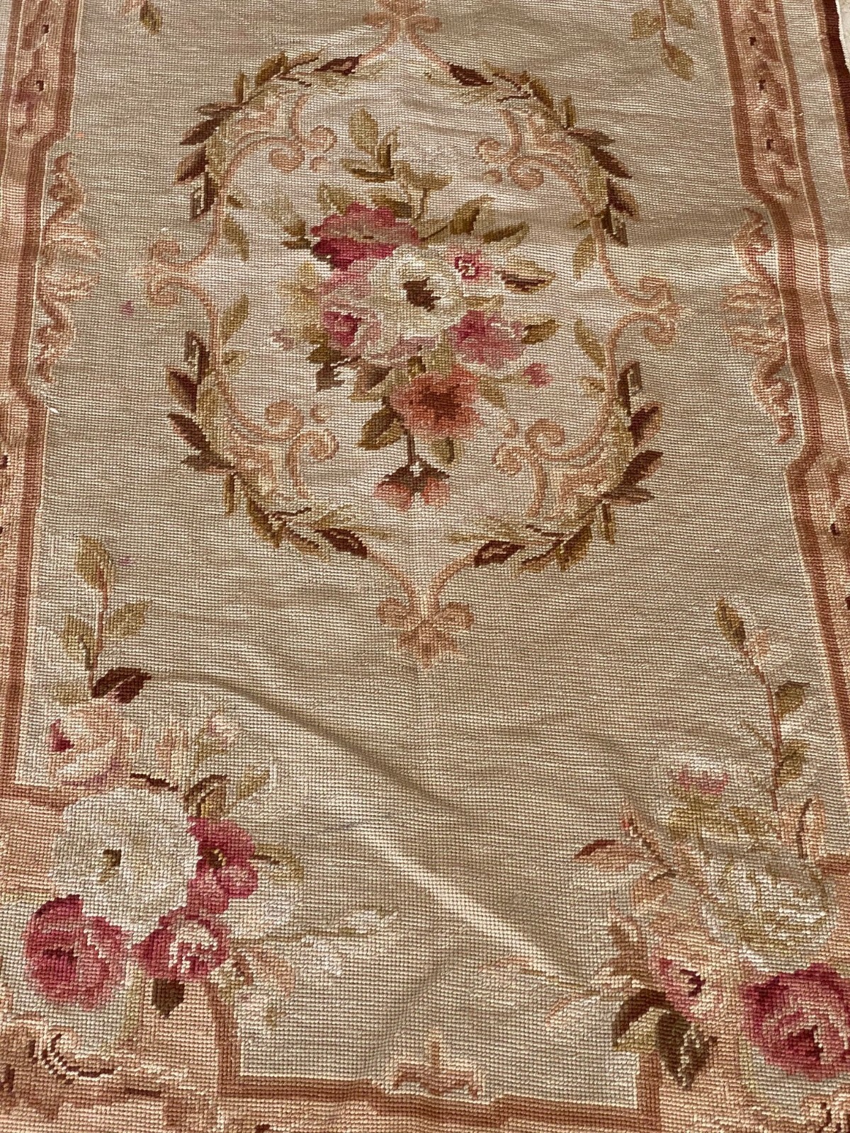 three floral antique style needlepoint area rugs variation in sizes