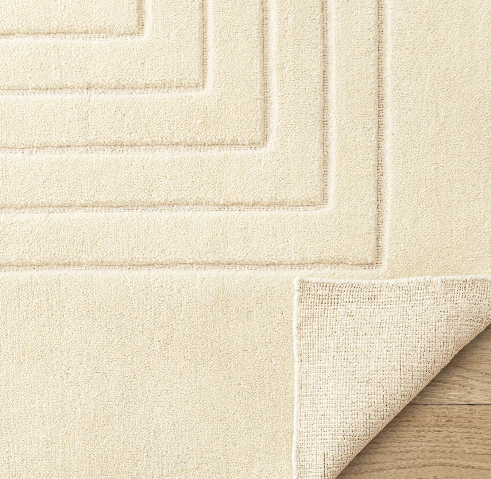 Hand sculpted with high-low dimension, the dense pile is sheared to a soft, text
